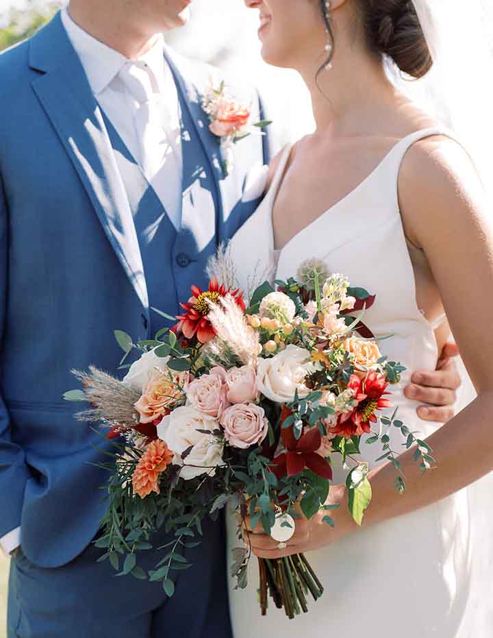 bride and groom with bouquet