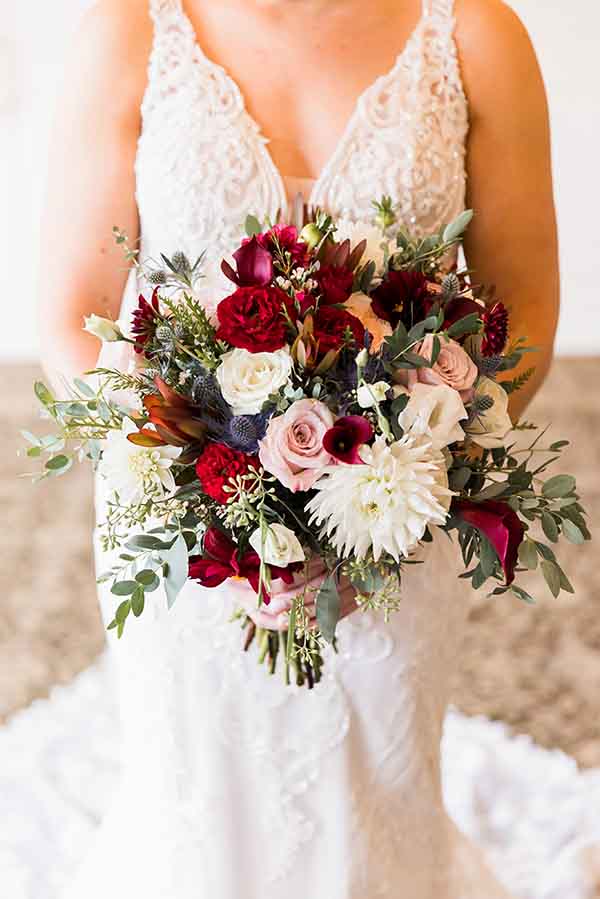 bride holding beautiful bouquet of flowers